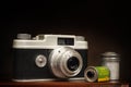 Old 1950Ã¢â¬â¢s 35mm Camera and Film on Brown With Copy Space Royalty Free Stock Photo